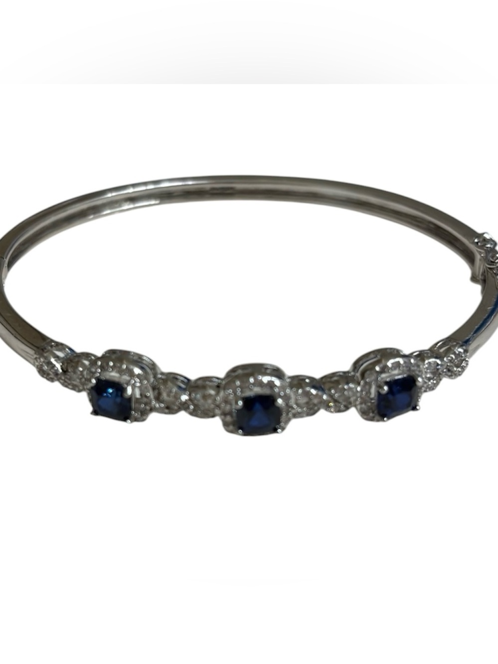 Silver plated bangle with sapphire blue CZ stones